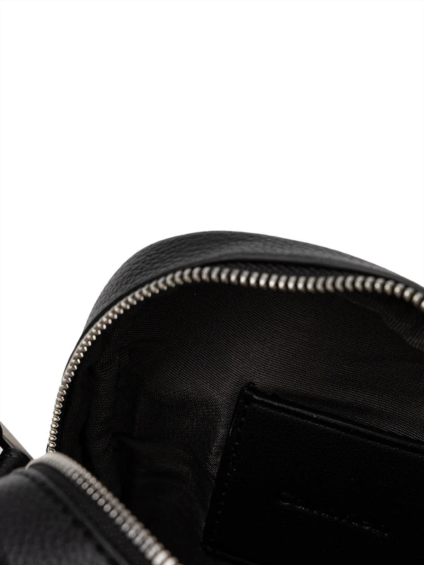 CALVIN ACC.1USCITA Borsa A Tracolla Calvin Klein Emblem Aop Emboss Slim Reporter - Nero