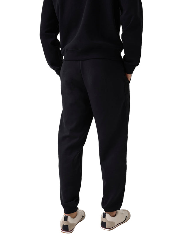 GUESS ATHLEISURE 1 USCITA Pantalone Tuta Guess Thor Cuffed - Nero